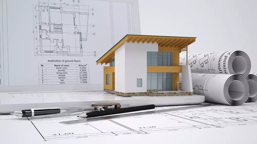 Planta de casa e miniatura. Imagem ilustrativa para texto habitação de interesse social.